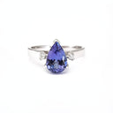Wide White Gold Band, Pear Cut Tanzanite with Petite Diamond Accents Ring