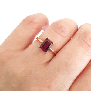 olitaire Four Claw Emerald Cut Grape Garnet Ring